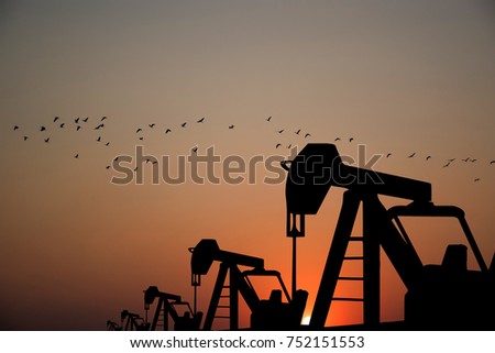 Oil industry equipment for petroleum in the sunset background, abandon pump, Low Demand concept.
