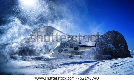 Helicopter taking of with group of freeriders Royalty-Free Stock Photo #752198740