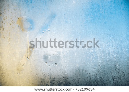 procent written on a foggy window blue sky on background