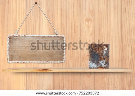 old canned on wooden shelf with wood background