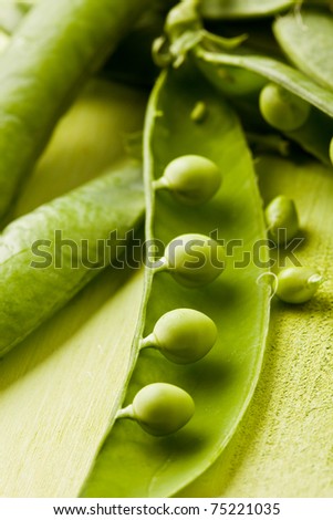 photo of fresh green peas on wooden table