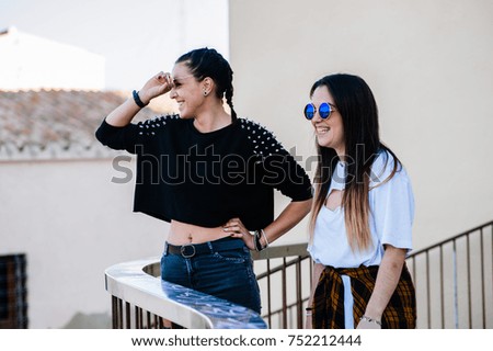 a couple of girls talking in the street