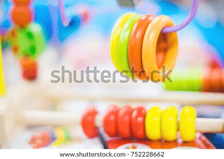 Blurry background of colorful Baby toys, Baby's learning equipment for learning skill. Selective focus on some piece of toy.