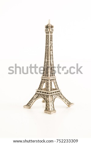 Eiffel Tower toy miniature on white background
