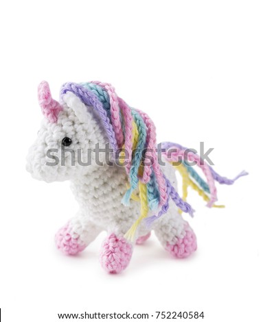 Crocheted amigurumi toy isolated on a white background