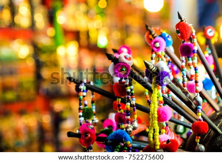 picture of colorful Thailand Hairpins in the bright thai market with the golden light background