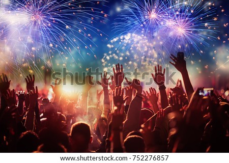 cheering crowd watching fireworks - new year concept Royalty-Free Stock Photo #752276857