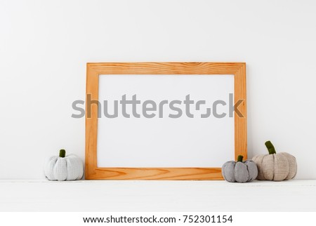 Horizontal wood frame and pumpkins on white background.  