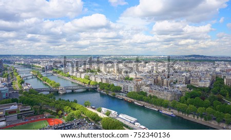 Iconic view of River Seine from Eiffel Tower with beautiful scattered clouds on a spring morning, Paris, France