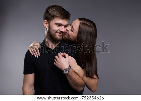 wonderful young couple dressed in jeans and black t-shirts