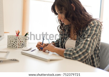 Young woman picking colors for next design