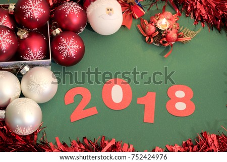 2018. 2018 numbers on green background with Christmas toys