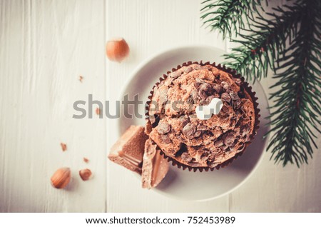 Chocolate muffin on white wooden background. Selective Focus Copy space. Vintage stile. Toned image