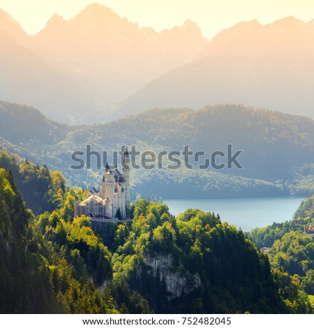 Famous Neuschwanstein Castle, 19th-century Romanesque Revival palace on a rugged hill above the village of Hohenschwangau near FÃ¼ssen in southwest Bavaria, Germany