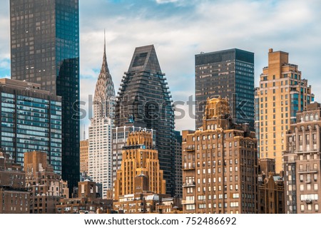 Teal and orange color of NYC midtown view and the East river from Roosevelt Island Royalty-Free Stock Photo #752486692