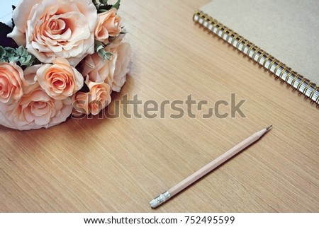 
Orange soft roses flowers over wooden desk.Backdrop with copy space