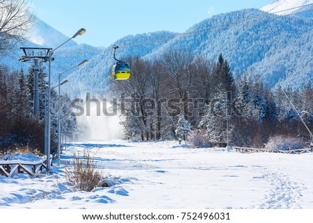 Bansko, Bulgaria ski resort panorama with cable car ski lift cabin and, slope and snow mountains