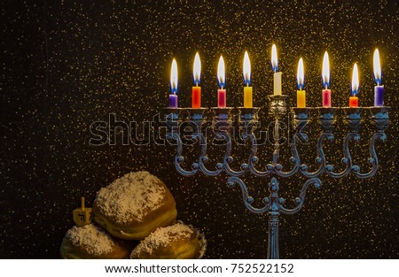 Image of the Hanukkah Jewish holiday with a menorah and burning candles