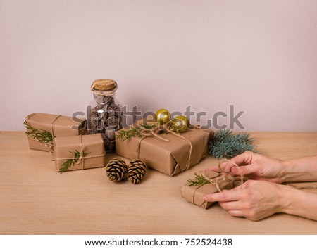 Christmas gifts with a decor on a wooden background