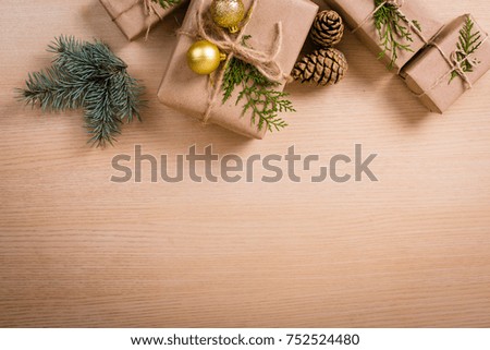 Christmas gifts with a decor on a wooden background