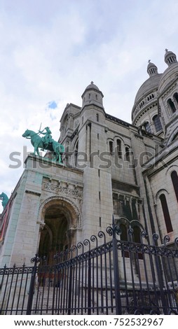 Spring photo from iconic basilica of Sacre Coeur with beautiful scattered clouds, Montmartre, Paris, France