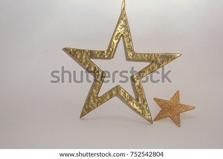 Golden Christmas ornament isolated, gift on light colour background