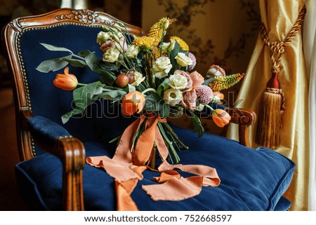 wedding bouquet at chair in a room