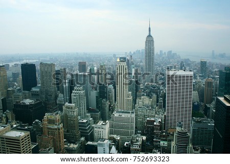 New York skyline and Empire State Building in Summer cloudy evening