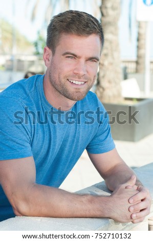 Handsome man smiling in sun portrait 