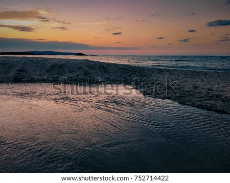 A picture of a marine landscape at sunset