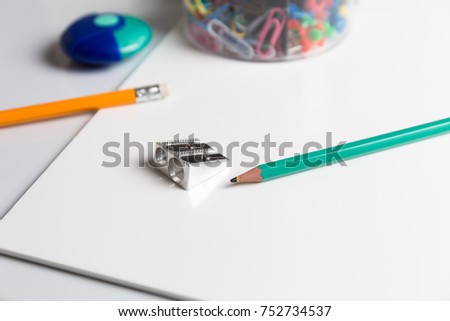 Pencil's and other stationary on a white background.