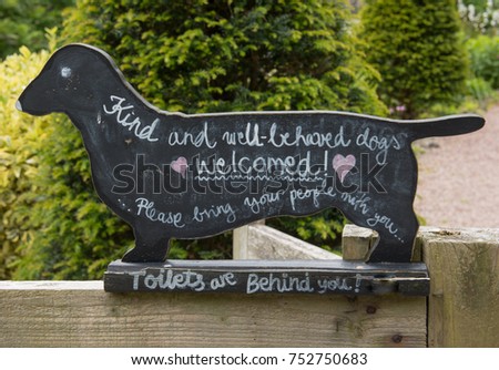 "Kind and Well Behaved Dogs, Welcomed! Please Bring your People with You, Toilets are Behind You" Sign 