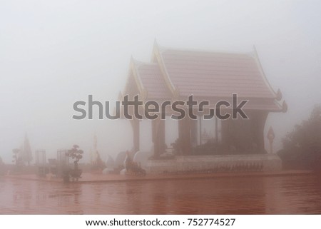 shrine at a Buddhist temple in the foggy mist at Chiang rai thailand