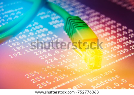 Ethernet cable on routing table colorful background