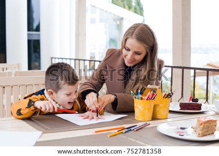 mother and son draw drawing hands colored pencils 1