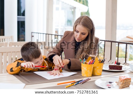 mother and son draw drawing hands colored pencils 1