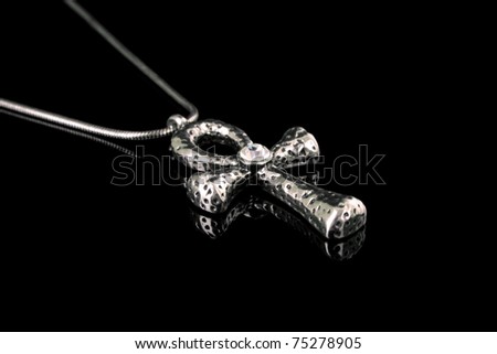 Egyptian cross as amulet isolated on black