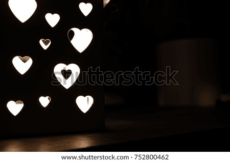Lantern glow on wood background