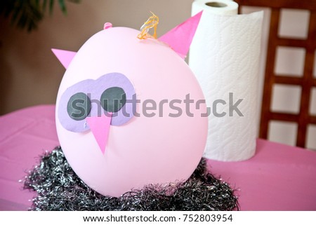 decorating a balloon into an owl