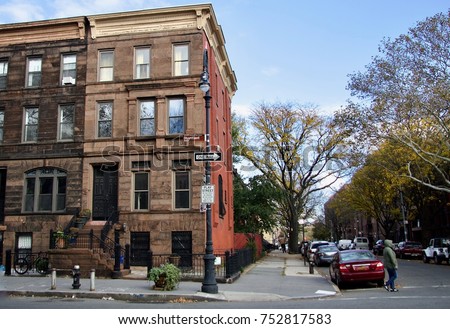 Classic Brownstone with street sign in the foreground. Bedford-Stuyvesant Brooklyn. New York USA