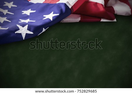 Veterans day concept of USA flag on green background