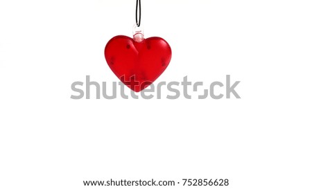 Red heart 3d on isolated. hanging on the black rope white background