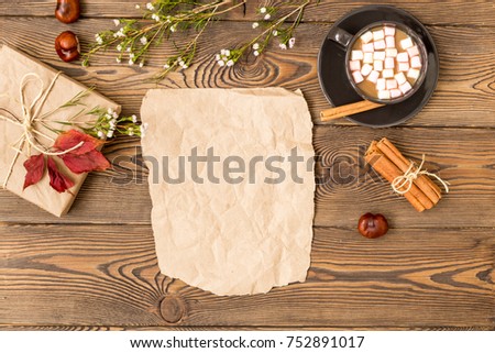 Autumn composition. Coffee with milk and marshmallow, gift, autumn leaves, cinnamon. Blanc template, invitation mock up.