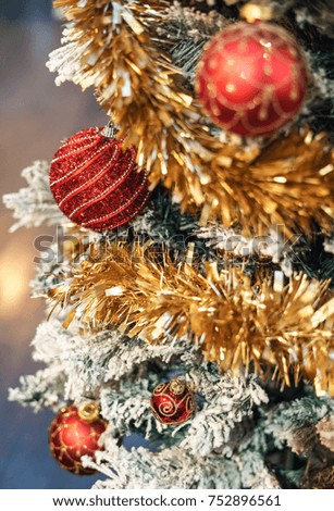 Red ball with christmas tree and bokeh