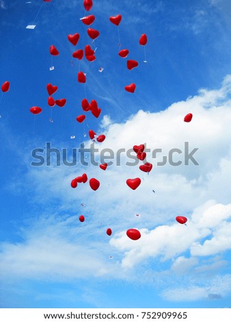 some heart balloons on the sky