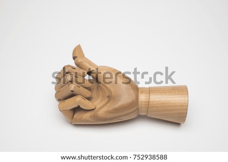 wooden hand on white