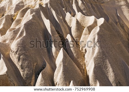 Frozen volcanic tuff waves and scenic landscape of the Rose Valley in Cappadocia, national park Goreme, Turkey.