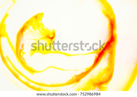 Abstract of color reaction between milk and color ink - yellow