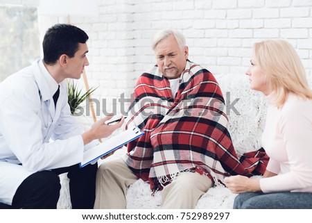 A doctor came to the old man in a yellow cardigan. The old man became ill and the doctor interrogates him. Next to him is the old man's wife. They are in the house of an elderly couple.