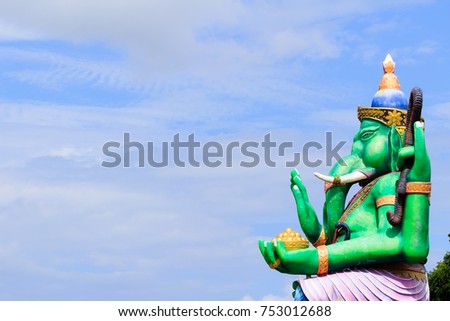 The Lord Ganesha Statue (Hindu God Ganesha) in The Thai Public Temple with Blue Sky. Copy Space for Text.(This picture is taken in a public area and be permitted to take picture for sale)